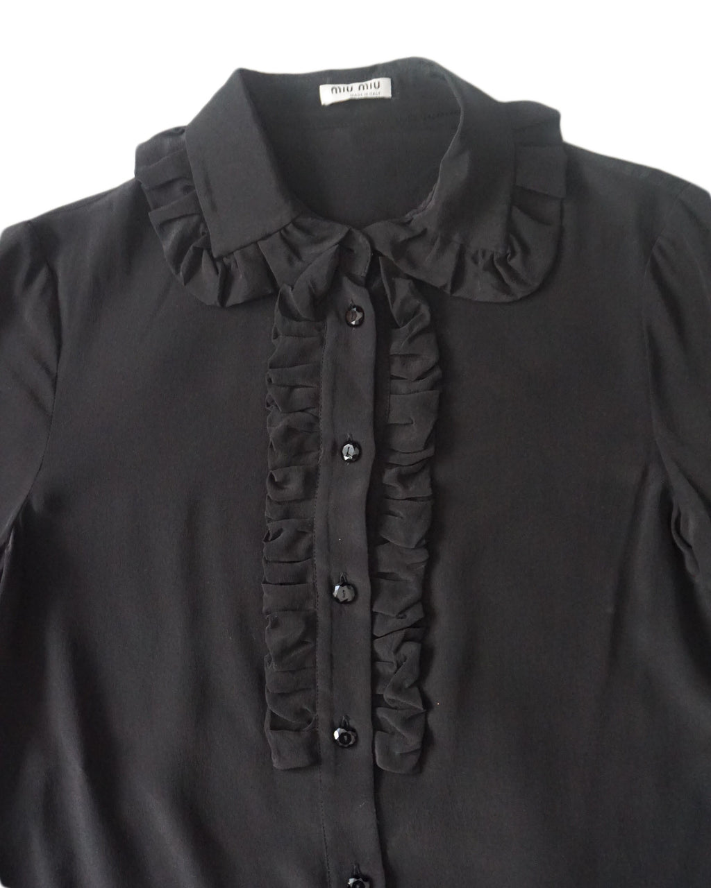 miu miu  - Blusa negra con cuello ondulad