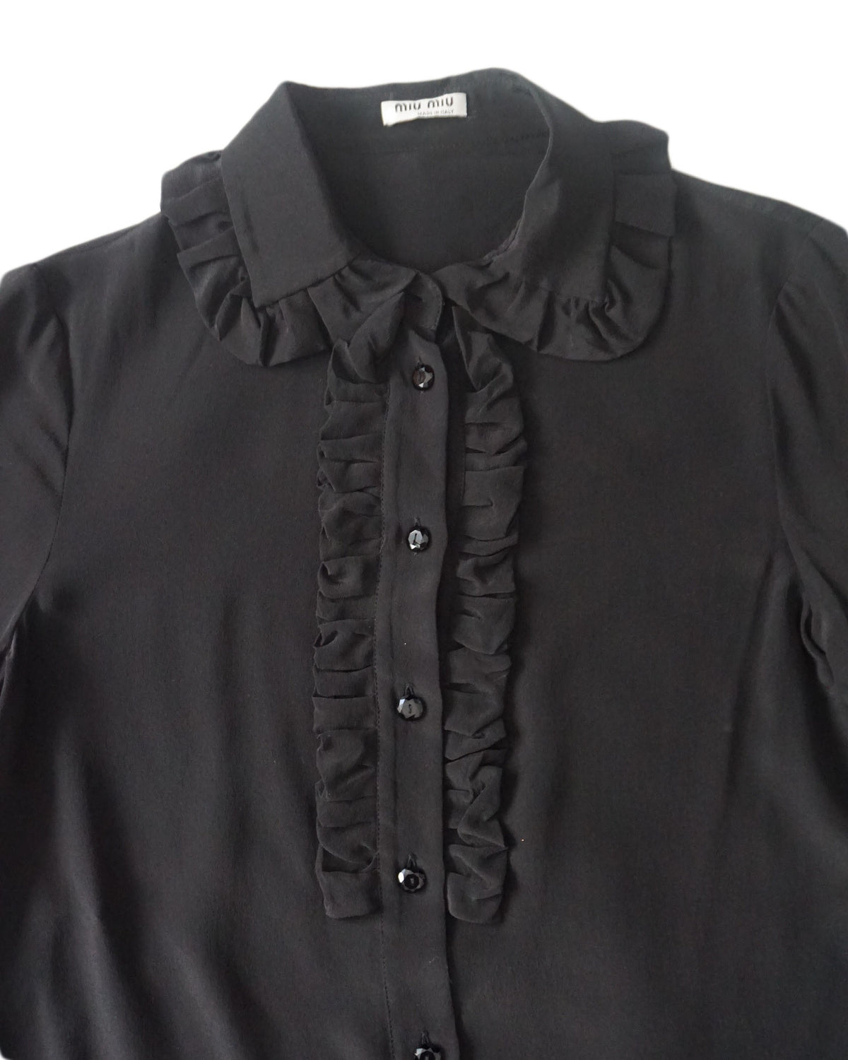 miu miu  - Blusa negra con cuello ondulad