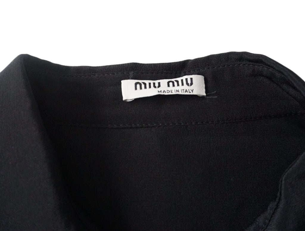 miu miu  - Blusa negra con cuello ondulad