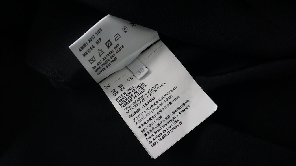 miu miu  - Blusa negra con cuello ondulad