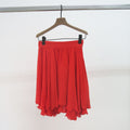 Gianni Versace falda roja vuelo